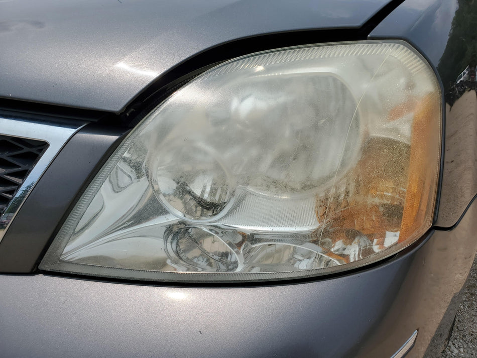 2005-2007 Ford Five Hundred Front LH Headlight Assembly (halogen)cloudy OEM