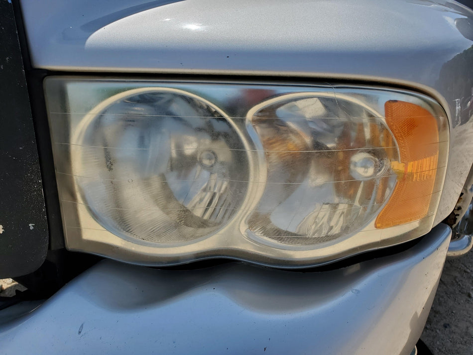 2002-2005 Dodge Ram 1500 Front LH Headlight Assembly (faded) OEM